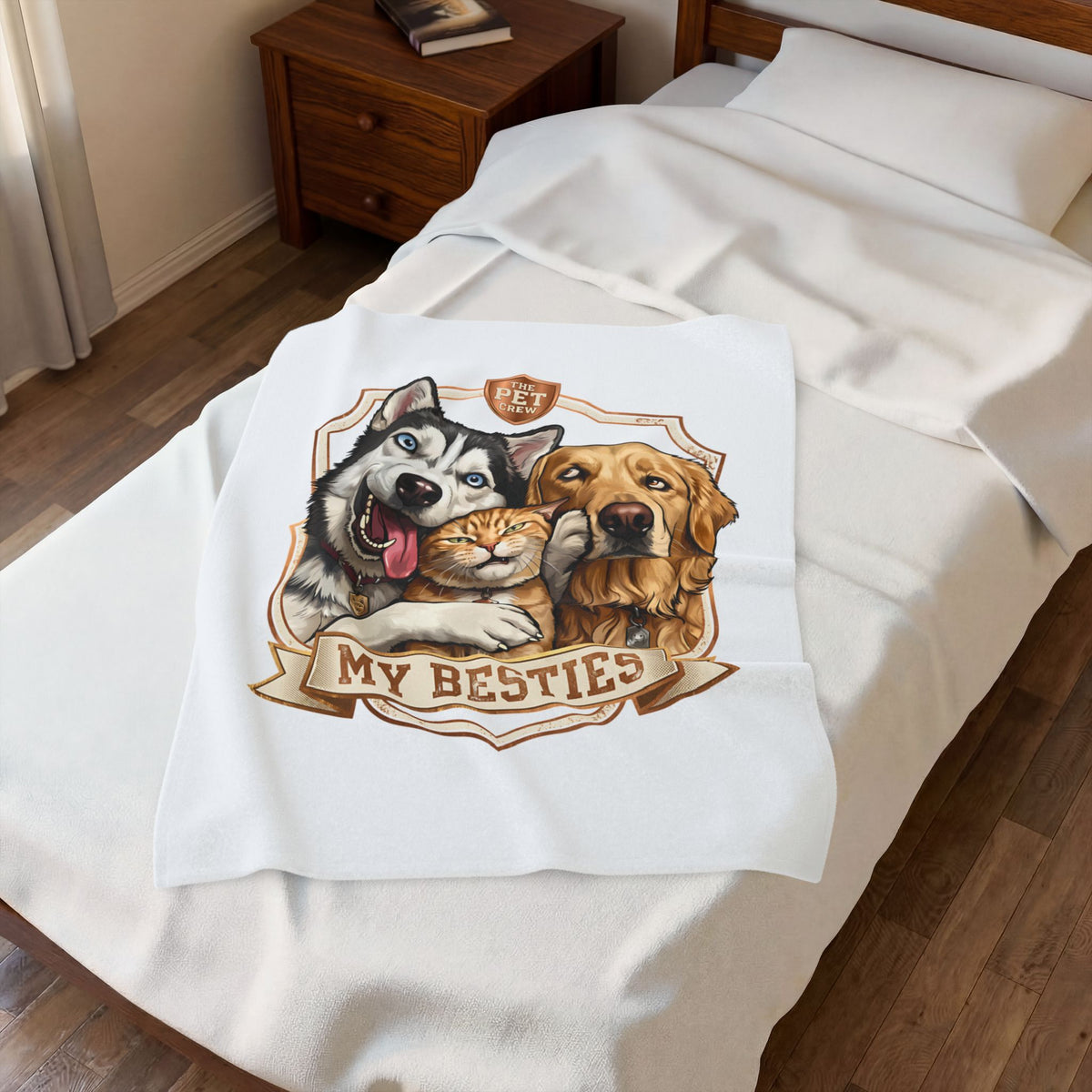 My Besties velveteen plush throw, 30 by 40 inches, folded on the corner of a bed.