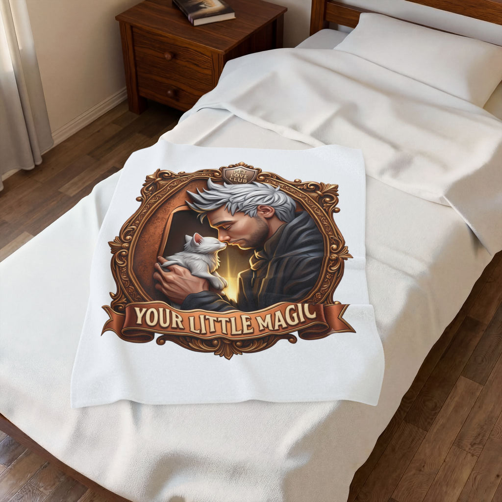 Your Little Magic velveteen plush throw, 30 by 40 inches, folded on the corner of a bed.