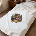 Maine Coon Dad velveteen plush throw, 30 by 40 inches, folded on the corner of a bed.