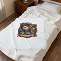 Real Men Love Cats velveteen plush throw, 30 by 40 inches, folded on the corner of a bed.
