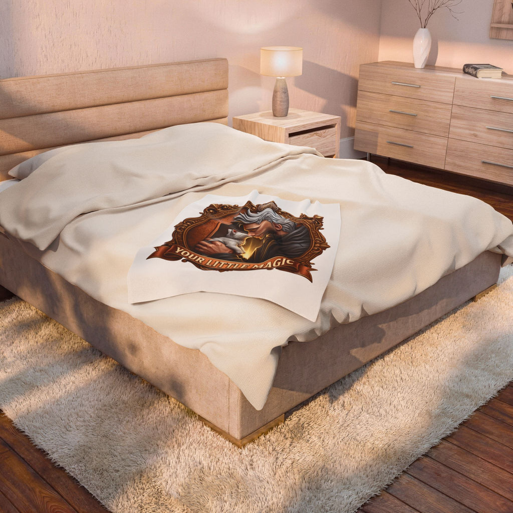 Your Little Magic velveteen plush throw, 30 by 40 inches, folded at the foot of a bed.