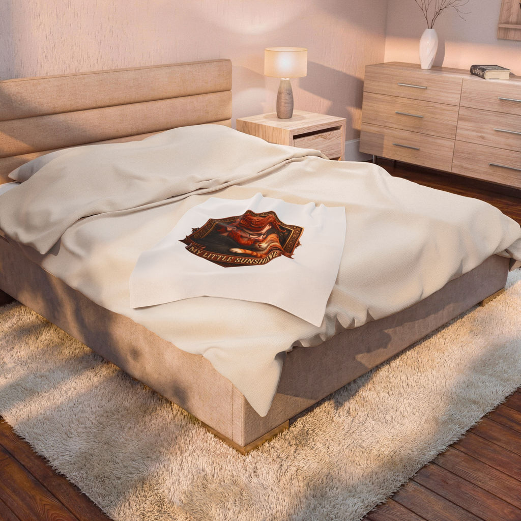 My Little Sunshine velveteen plush throw, 30 by 40 inches, folded at the foot of a bed.