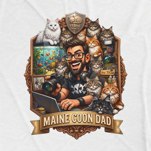 Close-up of the Maine Coon Dad crest: a grinning man in glasses holding two Maine Coons, with a bronze shield reading FELINE FANATIC above the frame and a ribbon reading MAINE COON DAD below.